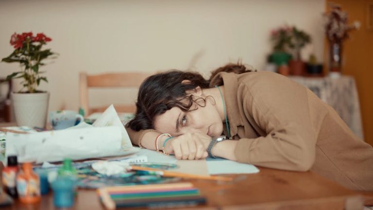 stressed person overwhelmed desk ADHD focus