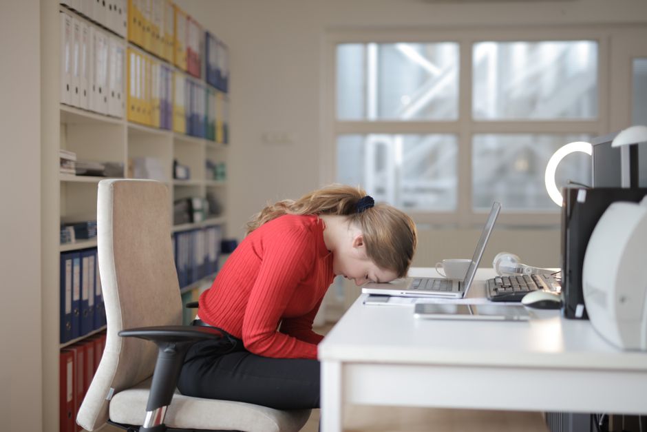 tired person desk exhausted ADHD focus